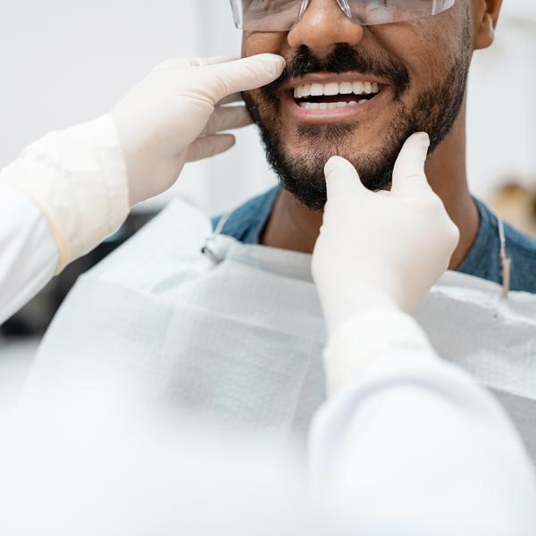 smiling man in dental chair