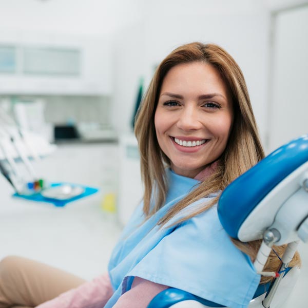 smiling woman in dental chair