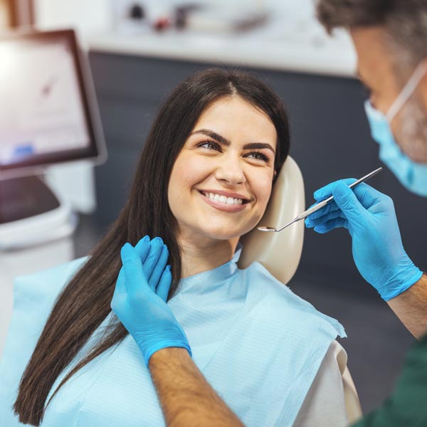 smiling woman in dental chair